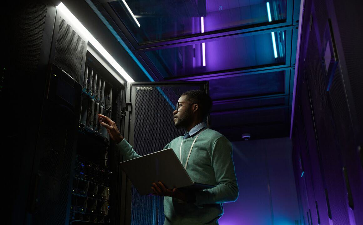 A cybersecurity employee working a data server